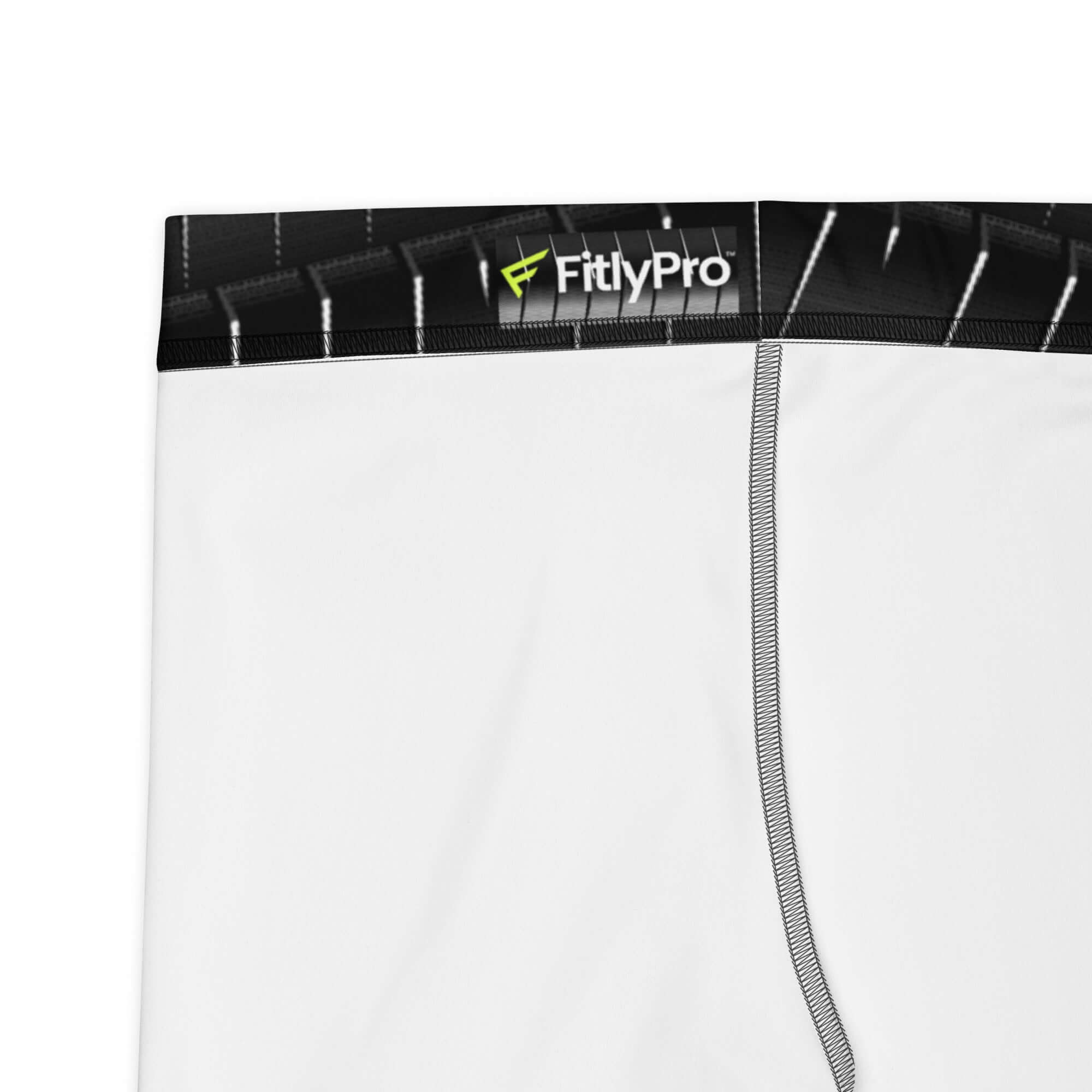 Close-up of FitlyPro logo on waistband of sleek white shorts designed for optimal movement and comfort.