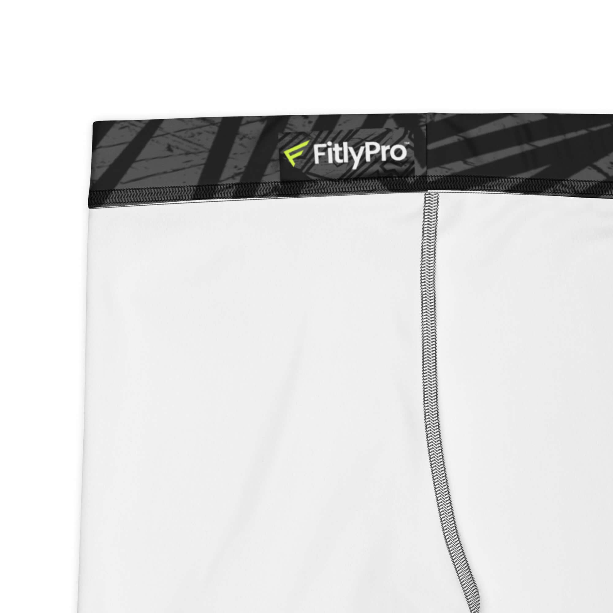 Close-up of FitlyPro Women's MotionTech Shorts with geometric black design and white fabric.
