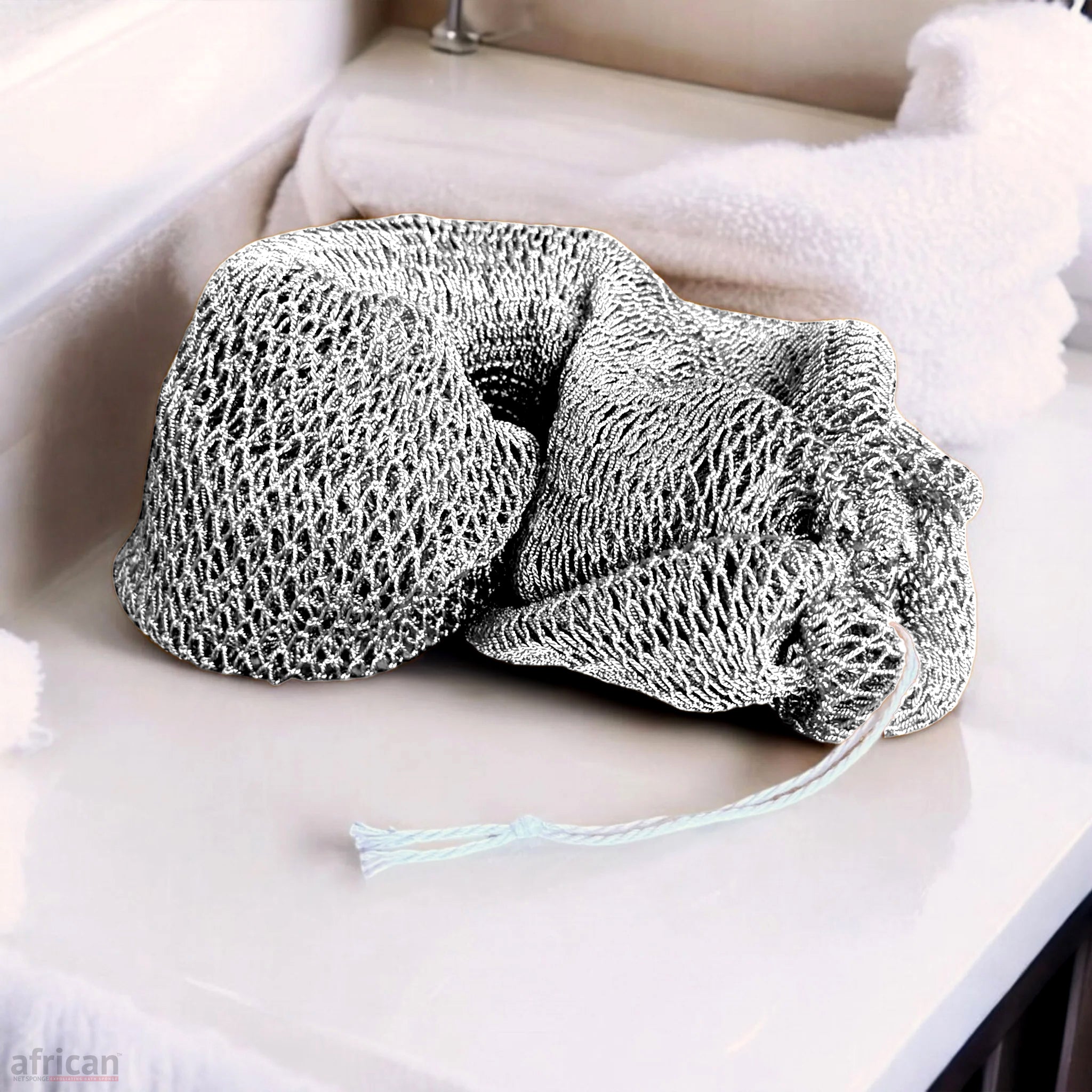 African Exfoliating Net Bath Smooth - African Net Sponge in white, featuring a textured mesh design for complete-body cleansing.
